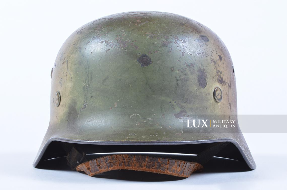 M35 Heer three-tone spray camouflage combat helmet with battle damage - photo 11