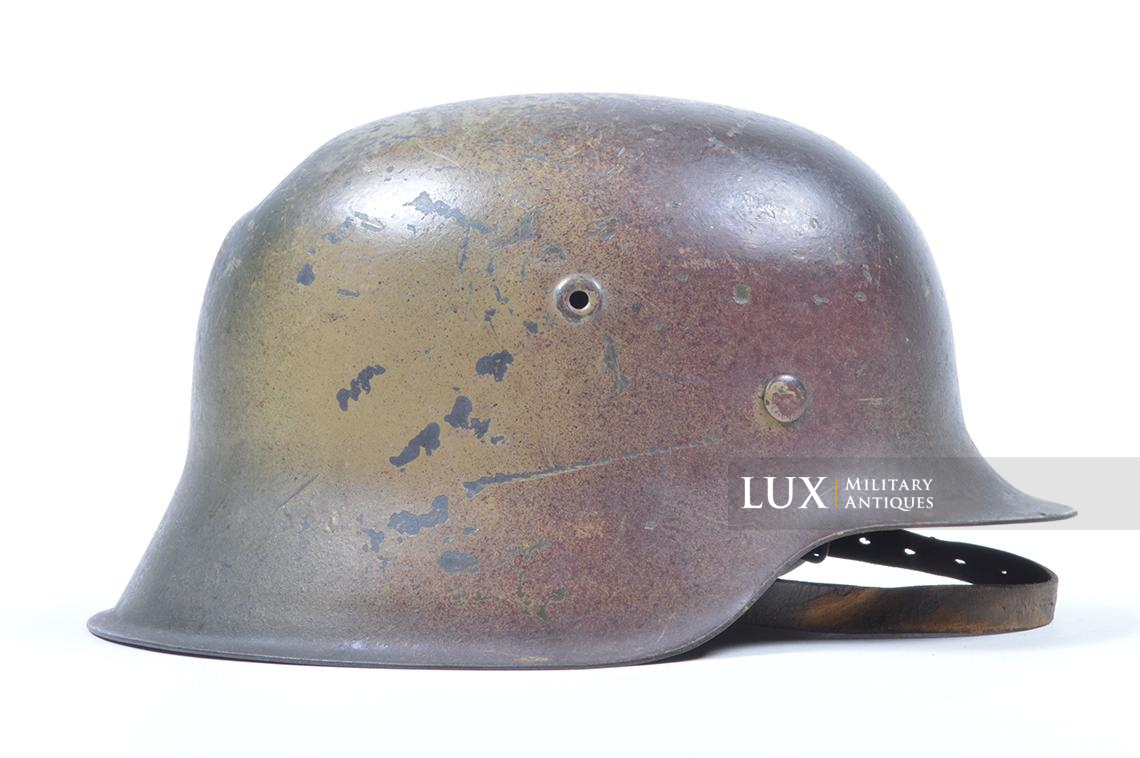 M42 Luftwaffe three-tone spray camouflage combat helmet with battle damage - photo 10
