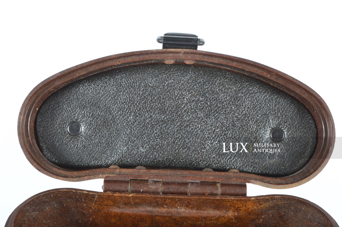 A large red simulated leather backgammon case belonging to Sir Roger Moore